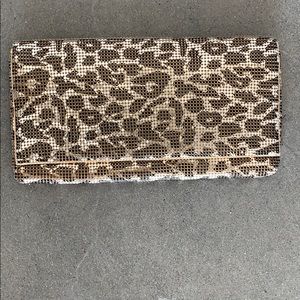 Metallic gold leopard clutch